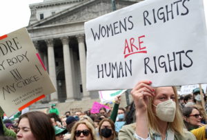 Photo of a women's protest in front of the capitol building