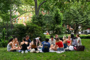 NEW YORK, NEW YORK - JULY 24: People sit and have a picnic in Washington Square Park during a heat wave on July 24, 2022 in New York City. The five boroughs of New York City are under a heat advisory until 8 PM on July 24th according to the US National Weather Service. Much of the East Coast is experiencing higher than usual temperatures as a heat wave moves through the area forcing residents into parks, pools and beaches to escape the heat. (Photo by Alexi Rosenfeld/Getty Images)